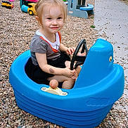 Kingslee joined the competition — help win amazing prizes! child, toy_car, outdoor, gravel, play, smile, steering_wheel, plastic, young_child, casual_clothing, short_sleeves, pathway, toys, playground_equipment, happy, cute, summer, daylight, fun, small