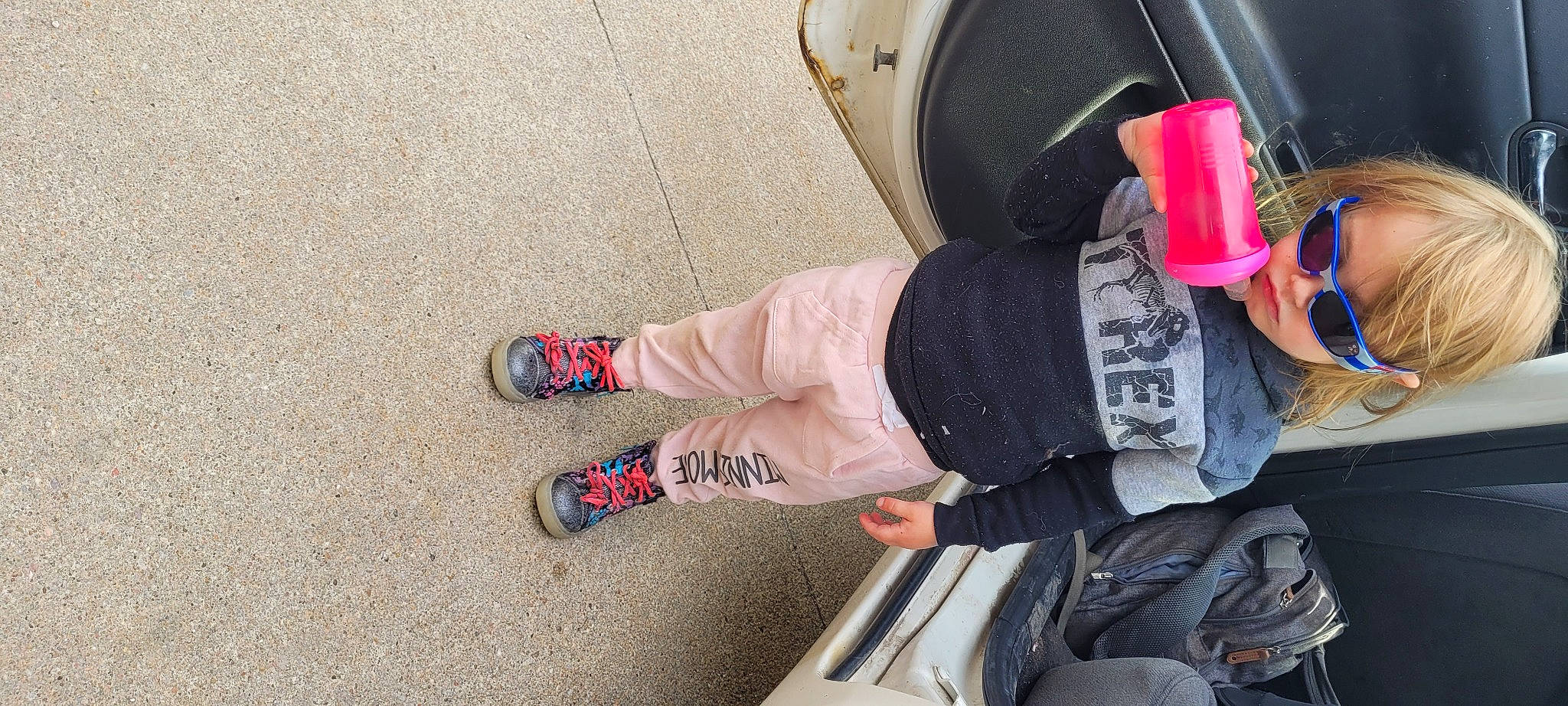 Nevaeh is registered to the contest to win money with this photo: asphalt, automotive_tire, calf, carmine, cool, finger, flooring, foot, fun, human_leg, knee, nail, outdoor_shoe, person, recreation, road_surface, rolling, shoe, sneakers, tire