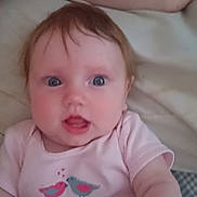 Briella joined the competition — help win amazing prizes! baby, infant, pink_onesie, birds_print, blue_eyes, curious_expression, soft_skin, short_hair, arm, bed, blanket, indoor, closeup, child, person, cute, portrait, human, newborn, toddler