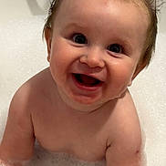 Noah is registered to the contest to win money with this photo: baby, bath, foam, water, smile, happy, child, skin, wet, face, eyes, mouth, hair, cute, tub, plumbing, faucet, bubble, person, indoor