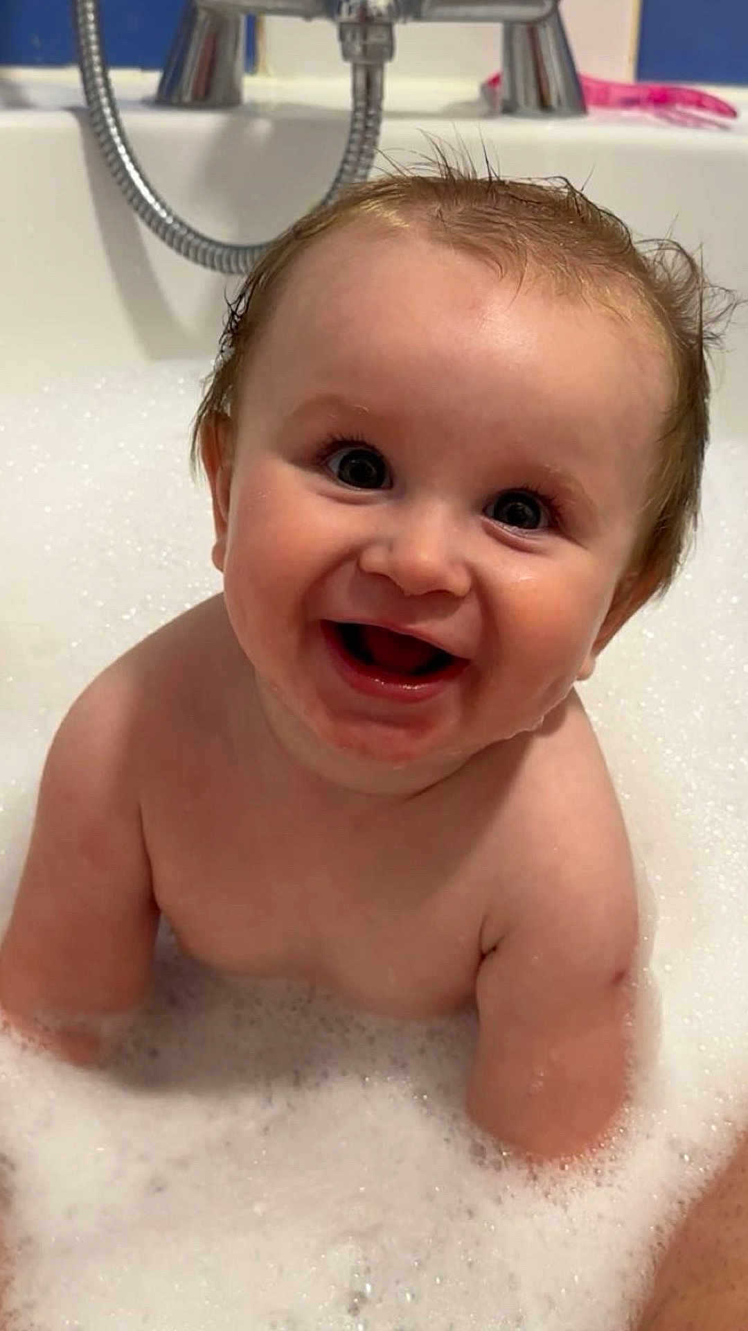 Noah is registered to the contest to win money with this photo: baby, bath, foam, water, smile, happy, child, skin, wet, face, eyes, mouth, hair, cute, tub, plumbing, faucet, bubble, person, indoor