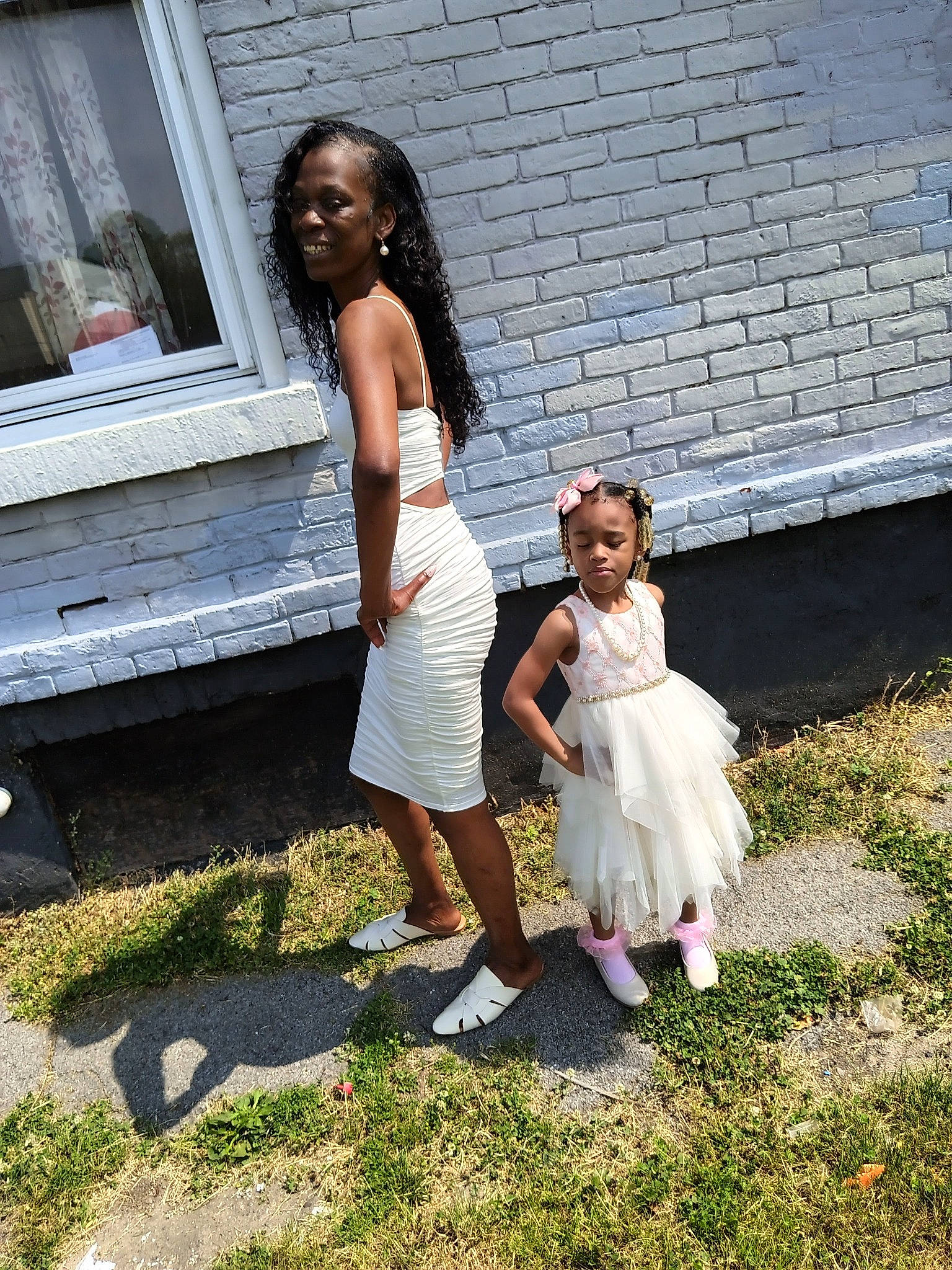 X'Zaniyla is registered to the contest to win money with this photo: child, dress, event, flash_photography, fun, gesture, grass, happy, headwear, human_leg, joy, lawn, leisure, people_in_nature, person, recreation, sandal, sitting, smile, standing