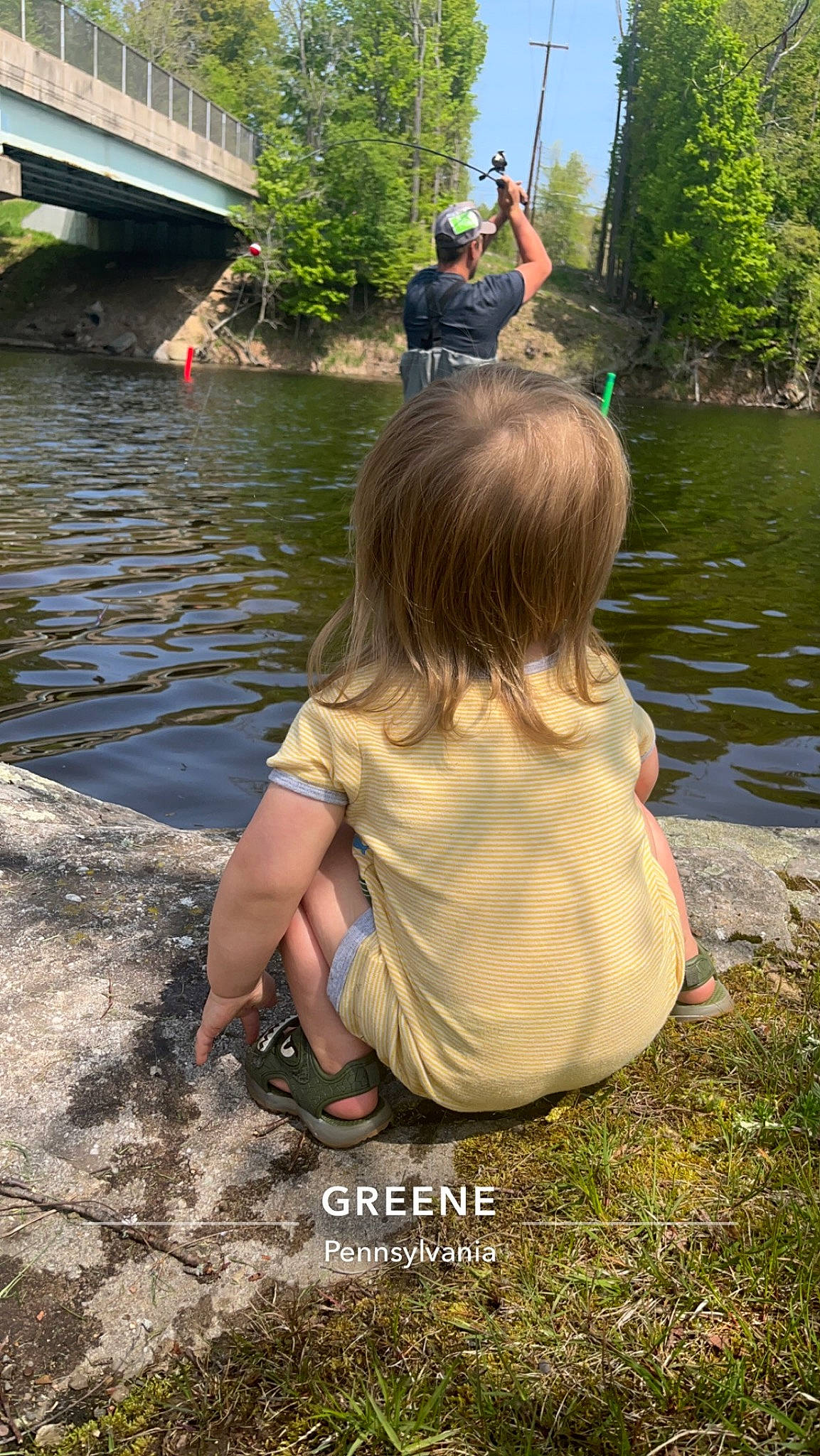 Ej joined the competition — help win amazing prizes! bank, botany, child, fun, grass, happy, lake, leisure, people_in_nature, person, plant, recreation, reservoir, rock, sitting, sky, spring, toddler, tree, water