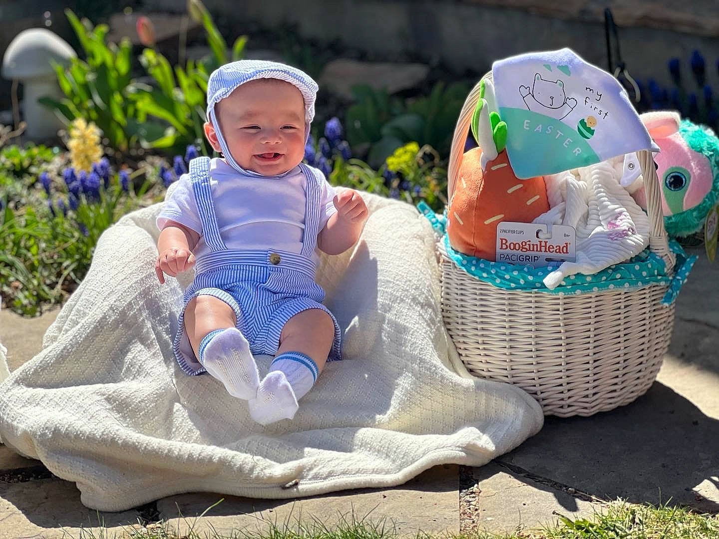 Avi is registered to the contest to win money with this photo: baby, baby_products, baby_toddler_clothing, basket, child, event, fashion_accessory, flower, fun, grass, happy, hat, headwear, leisure, people_in_nature, person, plant, recreation, sitting, smile