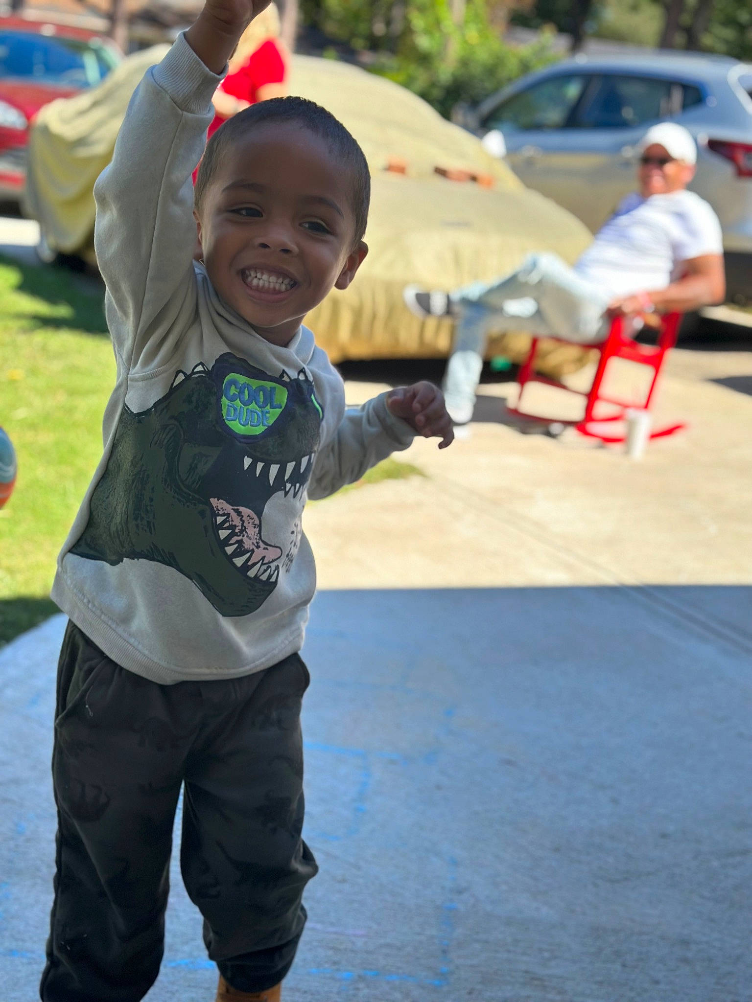 Kailer joined the competition — help win amazing prizes! asphalt, baseball_cap, cap, car, child, competition_event, event, fun, grass, happy, hat, headwear, joy, leisure, pedestrian, person, recreation, road, shorts, smile