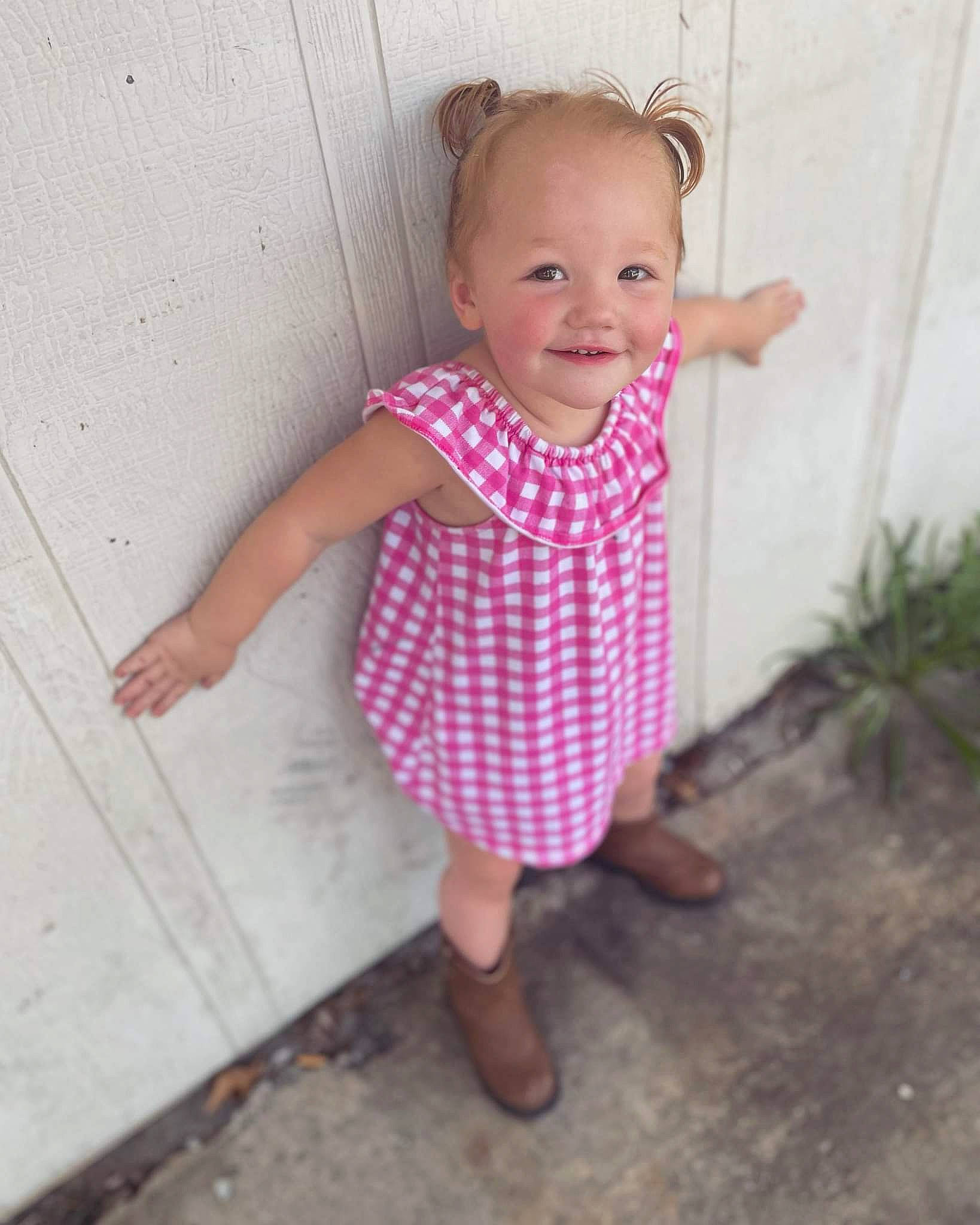 Avrianna is registered to the contest to win money with this photo: baby, baby_toddler_clothing, child, day_dress, face, foot, fun, happy, human_leg, joy, magenta, pattern, person, pink, plant, sandal, sleeve, smile, toddler, water