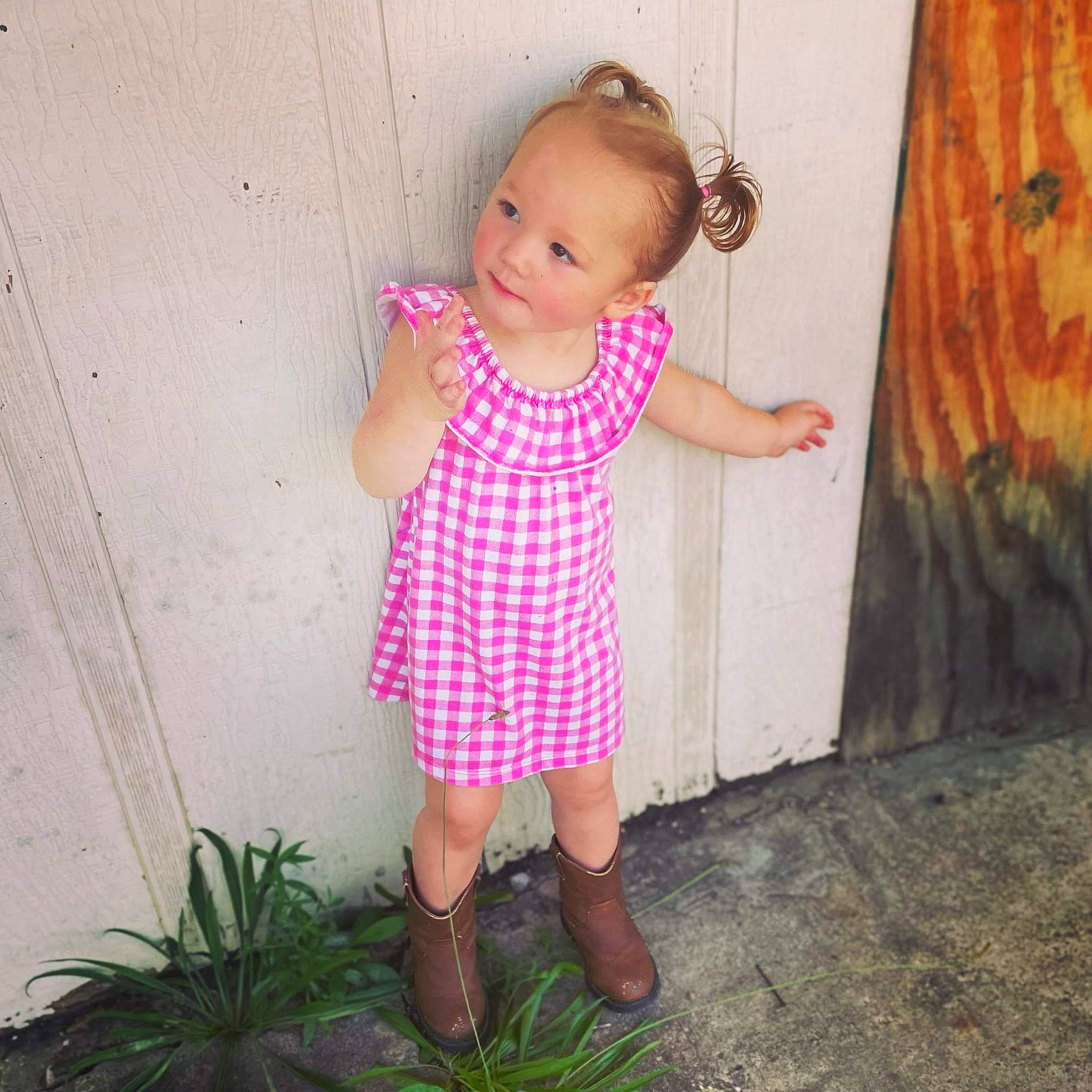 Avrianna joined the competition — help win amazing prizes! arm, baby_toddler_clothing, day_dress, door, dress, grass, hand, human_leg, joint, leg, magenta, pattern, people_in_nature, person, pink, plant, shoulder, sleeve, textile, toddler