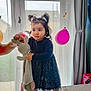 Chloe is registered to the contest to win money with this photo: balloons, barefoot, celebration, child, curtains, cute, decor, dress, floor, home, indoor, light, party, person, pigtails, plush_toy, table, toddler, toy, window