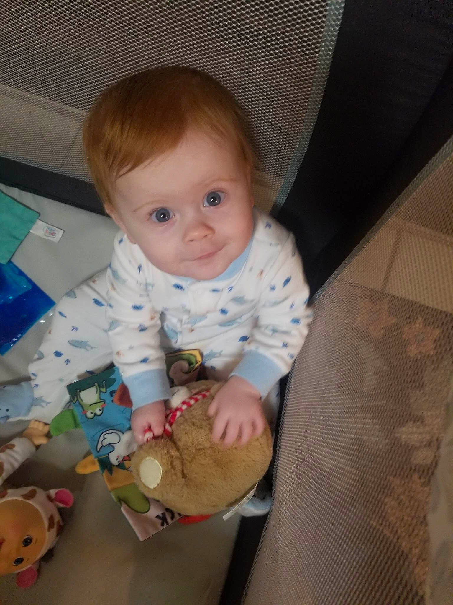 Anastasia joined the competition — help win amazing prizes! baby, baby_products, baby_toddler_clothing, cheek, child, comfort, eye, facial_expression, floor, flooring, fun, iris, person, room, sitting, skin, sleeve, smile, toddler, toy