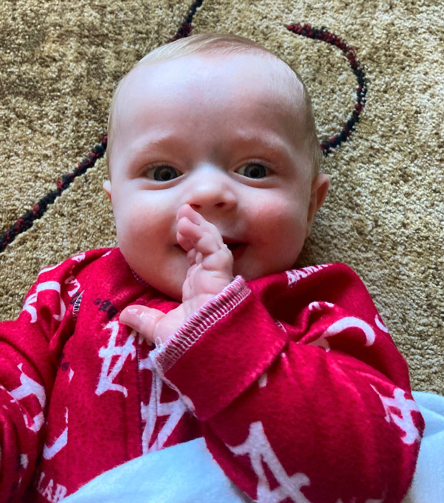 Rogan joined the competition — help win amazing prizes! baby, baby_toddler_clothing, cheek, child, eyelash, facial_expression, finger, grass, happy, head, iris, lip, mouth, nose, organ, person, pink, skin, smile, thumb