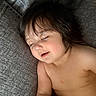 toddler, child, sleeping, face, hair, couch, gray, skin, peaceful, indoors, relaxation, portrait, young_child, nap, bare_shoulders, soft_light, cozy, rest, closeup, calm