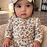 Emyriee-Jo joined the competition — help win amazing prizes! baby, child, onesie, leopard_print, headband, bow, indoor, carpet, soft_lighting, curious_eyes, portrait, cute, person, infant, hands, floor, home, sitting, young_child, fashion_accessory