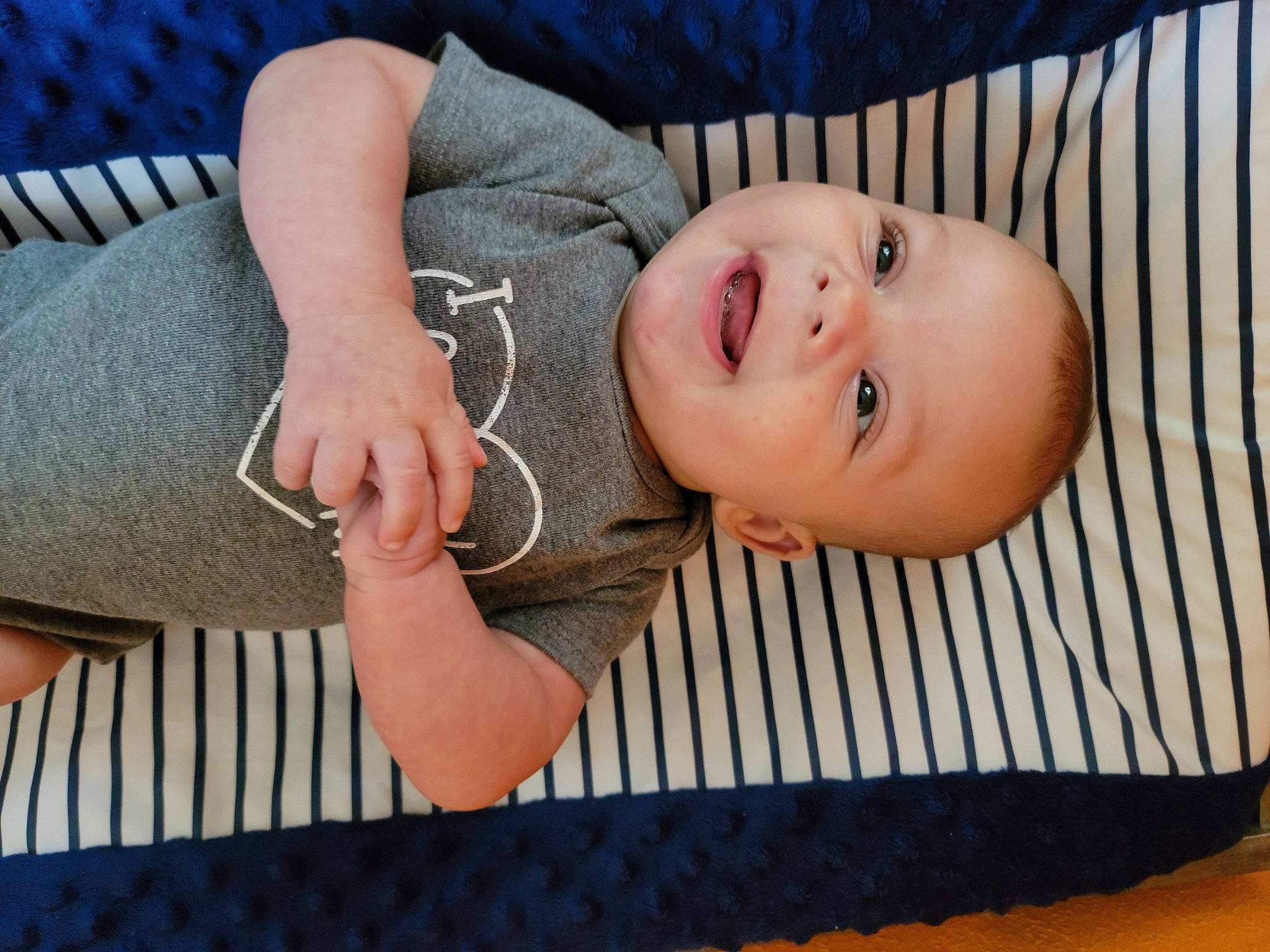 Kanen is registered to the contest to win money with this photo: baby, baby_safety, baby_toddler_clothing, blue, cheek, comfort, dress, eye, finger, happy, human_body, lip, nose, person, product, skin, smile, toddler, tree, window