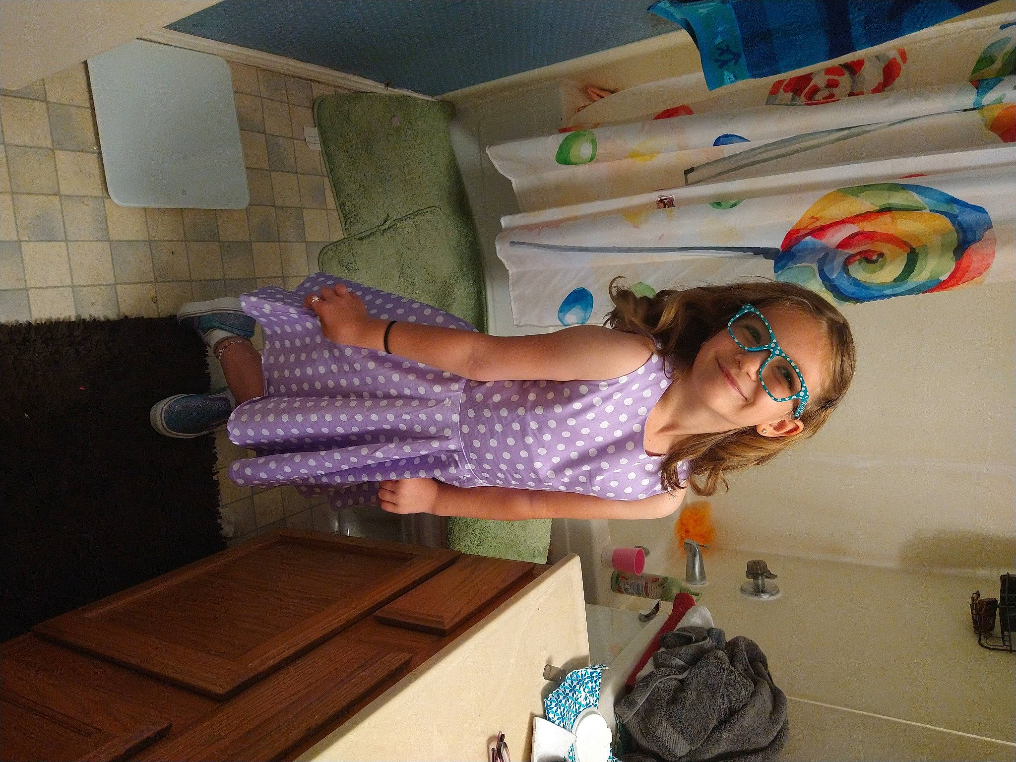 Astrid joined the competition — help win amazing prizes! backpack, bag, child, dress, eyewear, fun, happy, human_leg, joy, knee, leisure, luggage_and_bags, pattern, person, purple, room, sandal, smile, sock, textile