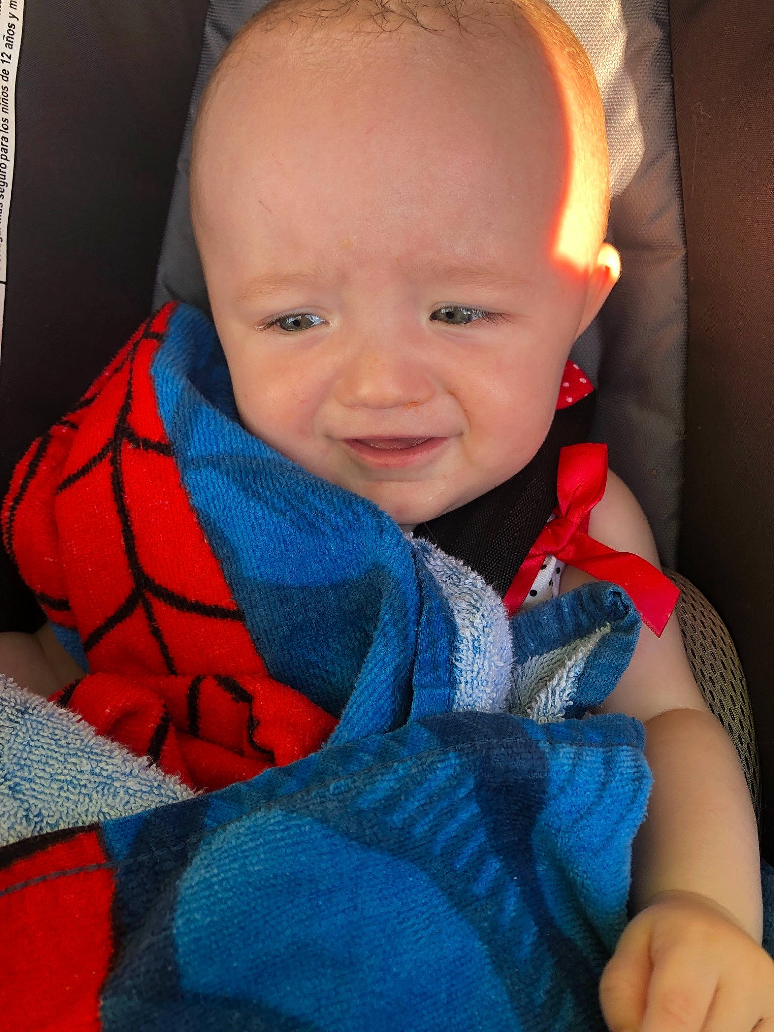 Magdalena is registered to the contest to win money with this photo: baby, baby_in_car_seat, blue, cheek, child, chin, eye, face, facial_expression, forehead, head, iris, lip, mouth, nose, person, product, skin, smile, textile