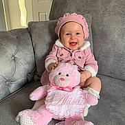 Akira joined the competition — help win amazing prizes! baby, pink_outfit, pink_hat, teddy_bear, smiling, sitting, couch, indoor, child, plush_toy, happy, cute, portrait, furniture, home, cozy, infant, soft_toy, clothing, person