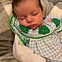 baby, sleeping, infant, soft_blanket, blue_outfit, embroidered_trees, peaceful, closeup, child, cute, resting, newborn, portrait, hand, white_sleeve, fabric, cozy, face, young_child, indoor