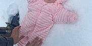 Rayleigh joined the competition — help win amazing prizes! baby, infant, pink_suit, snow, winter_clothing, outdoors, hands, cold_weather, cute, child, warm, snowy_ground, hooded_jacket, footwear, person, lying_down, winter, protection, small_child, fluffy
