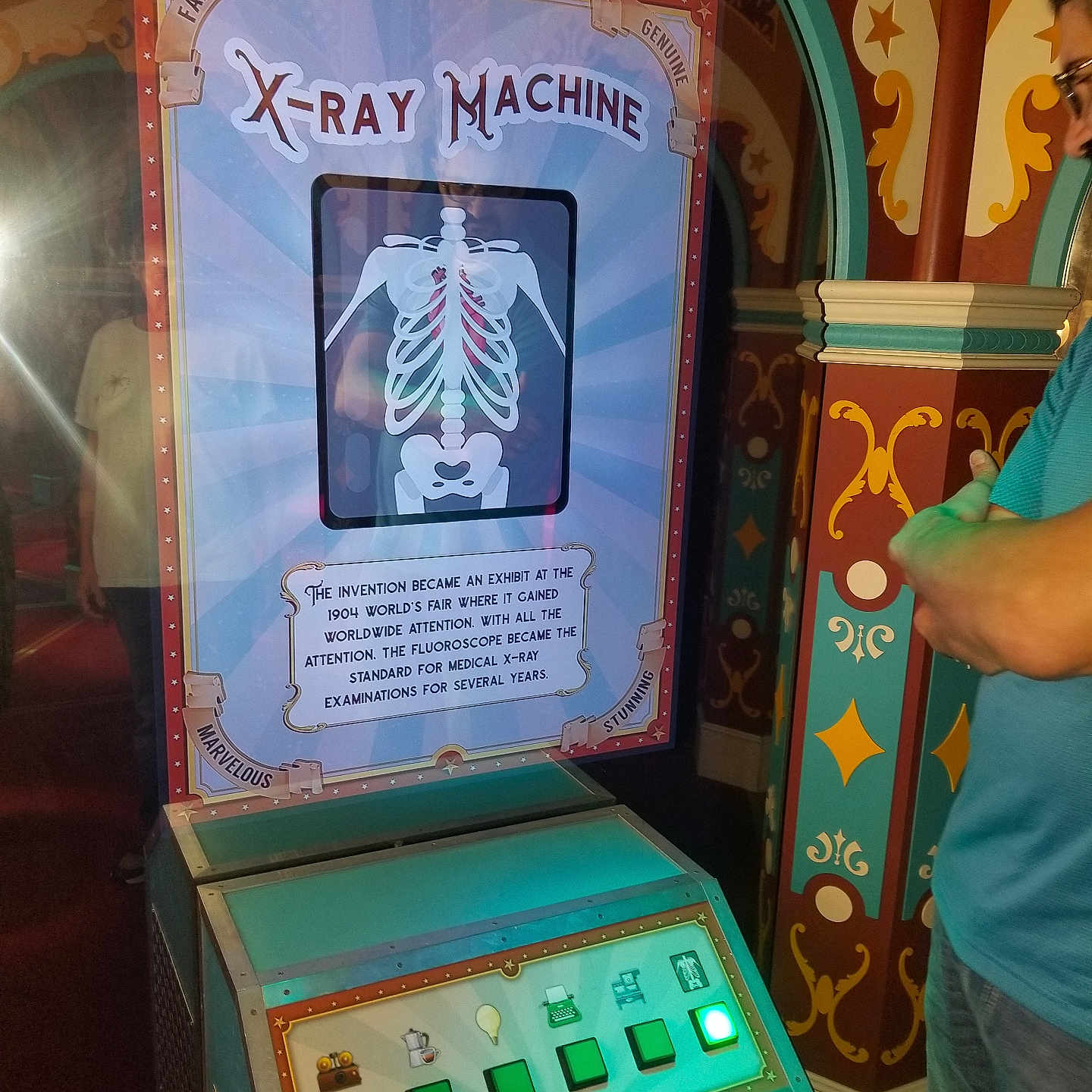 Charli joined the competition — help win amazing prizes! buttons, child, decorated_wall, display, exhibit, illustration, indoor, interactive, lighting, man, museum, observation, ornate, person, shorts, skeleton, technology, vintage, white_shirt, x_ray_machine