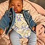 Heaven joined the competition — help win amazing prizes! baby, denim_jacket, floral_outfit, pink_blanket, soft_texture, indoor, infant, clothing, cute, portrait, sitting, warm, cozy, child, person, young_child, face, legs, feet, expression