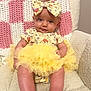 Emery is registered to the contest to win money with this photo: baby, child, tutu, yellow, headband, bow, smile, sitting, blanket, knitted, pink, white, chair, soft, cute, infant, clothing, portrait, happy, indoor