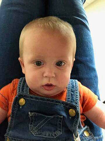 Landon is registered to the contest to win money with this photo: baby, baby_toddler_clothing, cheek, chin, comfort, cool, ear, eyebrow, eyelash, finger, forehead, iris, mouth, neck, nose, person, seat_belt, shoulder, skin, sleeve