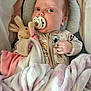 Sienna is registered to the contest to win money with this photo: baby, pacifier, blanket, plush_toy, bunny, clothing, infant, sleepwear, soft_toy, cute, child, portrait, indoors, comfort, bed, nap, cozy, hand, face, expression