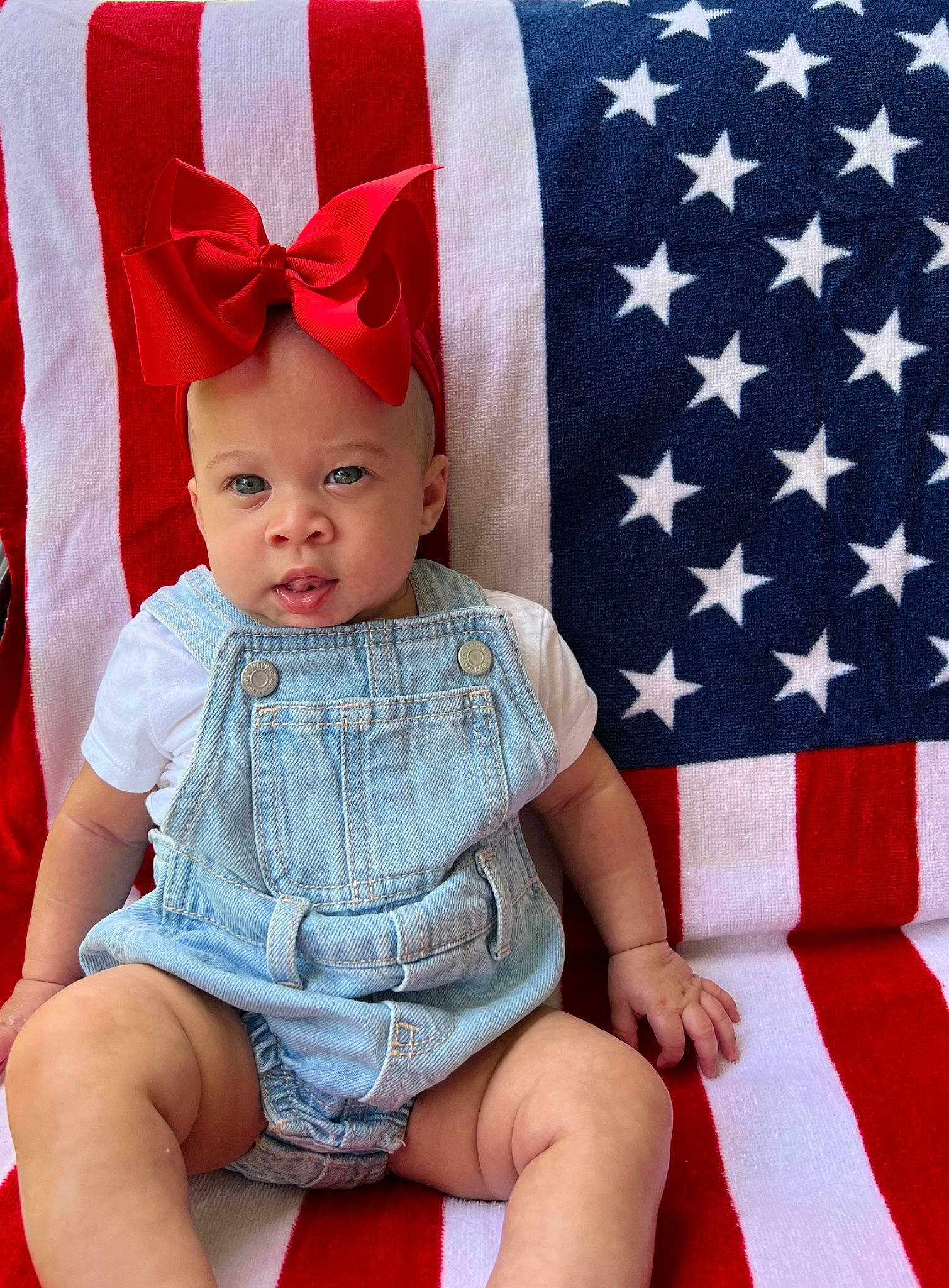 Kendall joined the competition — help win amazing prizes! baby, baby_toddler_clothing, blue, cap, costume_hat, dress, electric_blue, event, face, flag, flag_day_usa, flag_of_the_united_states, happy, pattern, person, red, sleeve, textile, thigh, toddler
