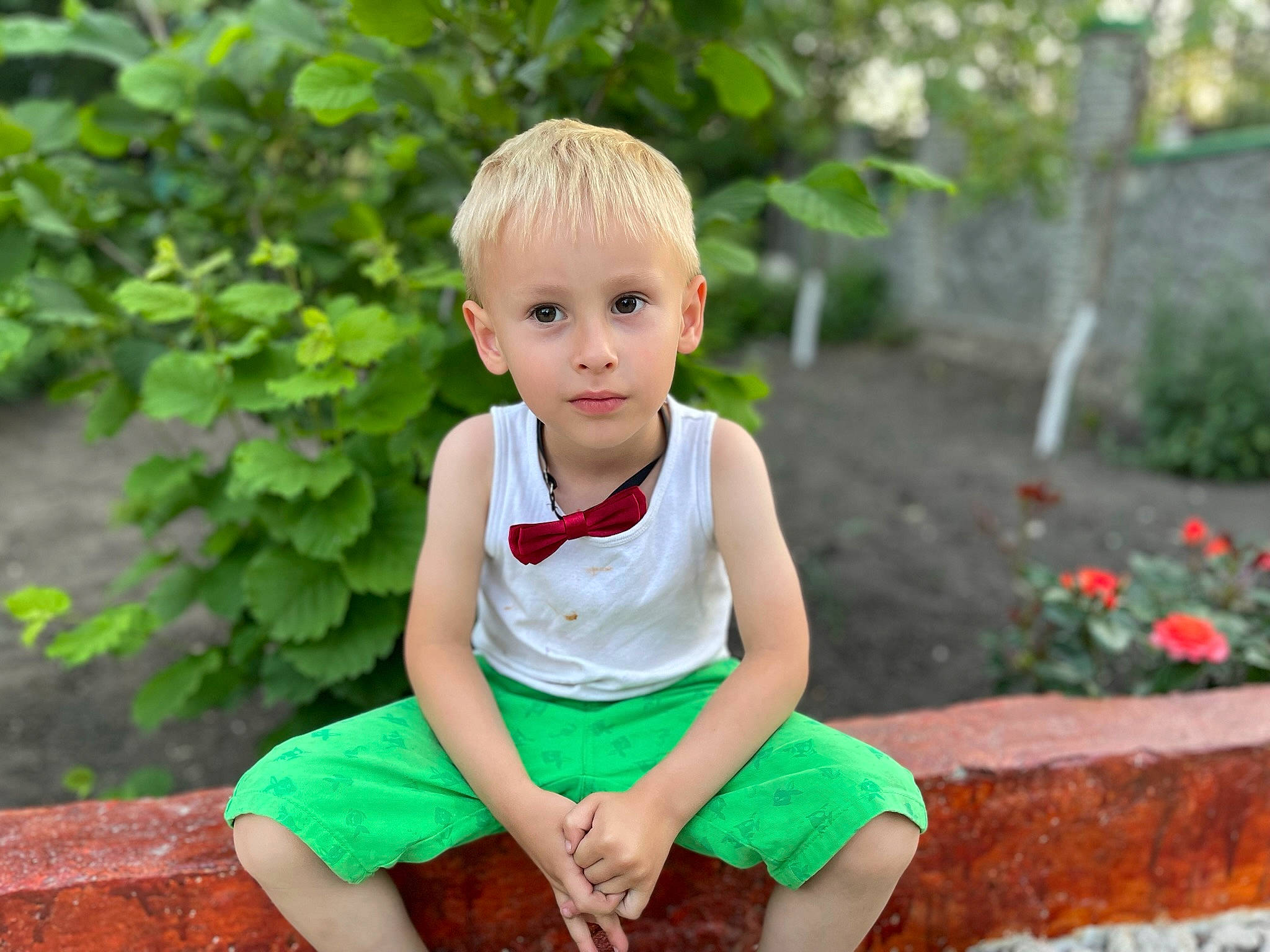 David is registered to the contest to win money with this photo: baby_toddler_clothing, cheek, child, dress, flower, foot, fun, grass, happy, leisure, people_in_nature, person, plant, recreation, shorts, sitting, sleeve, summer, t_shirt, toddler