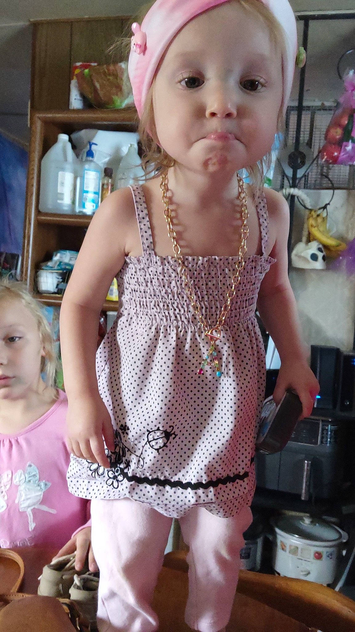 Athenna is registered to the contest to win money with this photo: baby_toddler_clothing, cheek, child, cooking, eyelash, facial_expression, fashion_design, hairstyle, happy, head, jewellery, kitchen_appliance, pattern, person, pink, shelf, skin, sleeve, thigh, toddler