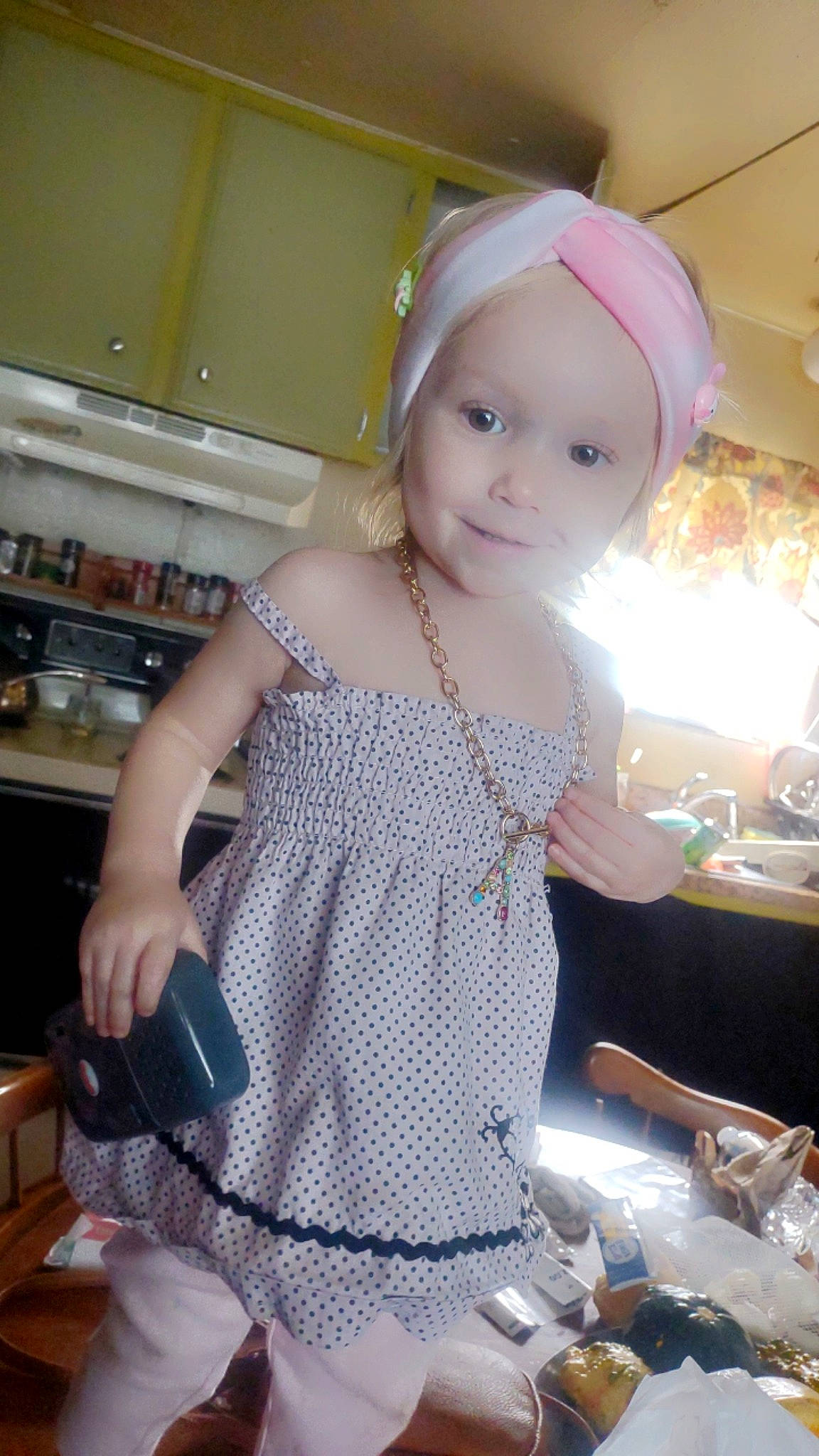 Athenna is registered to the contest to win money with this photo: abdomen, baby, cap, chest, child, cooking, fashion_accessory, fashion_design, happy, headpiece, headwear, homemaker, jewellery, kitchen, kitchen_appliance, pattern, person, sleeve, smile, tableware