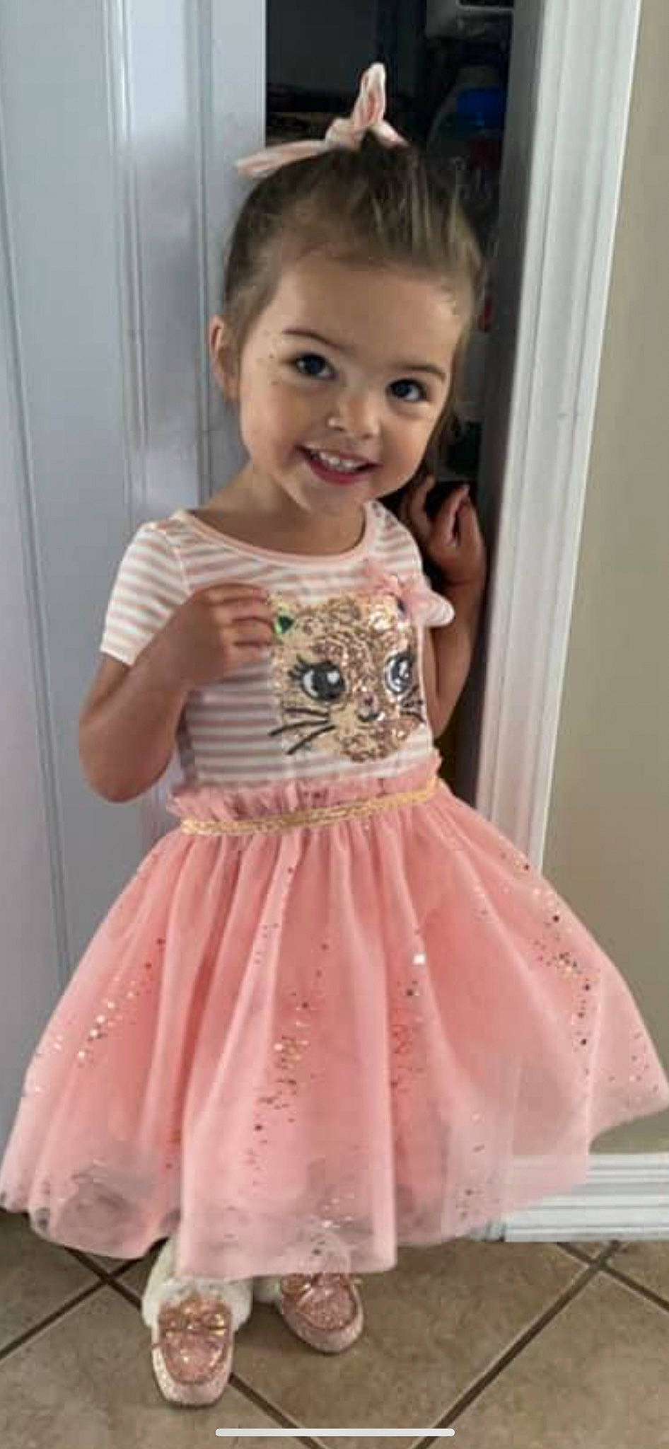 Eleah is registered to the contest to win money with this photo: baby_toddler_clothing, clothing, day_dress, dress, embellishment, eyelash, fashion, fashion_design, hair, iris, joy, one_piece_garment, pattern, person, pink, skin, sleeve, smile, standing, toddler