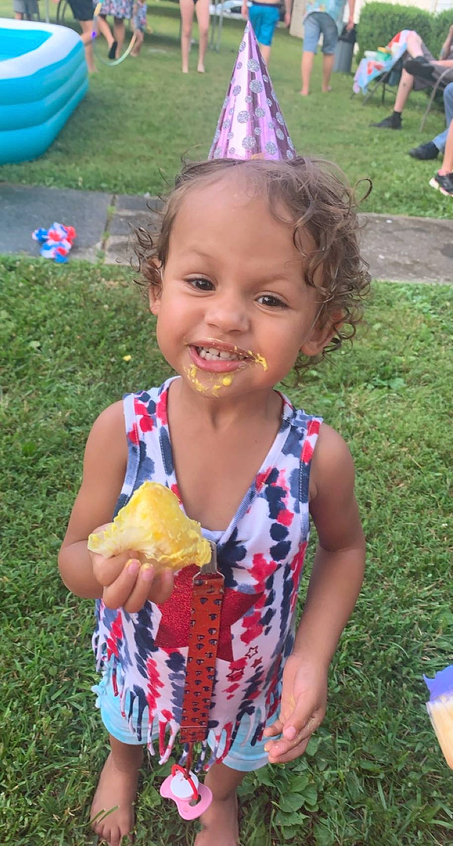 Adalia is registered to the contest to win money with this photo: baby, baby_toddler_clothing, blue, child, cuisine, event, fast_food, food, food_craving, fruit, fun, grass, green, happy, joy, leisure, party_hat, person, recreation, summer