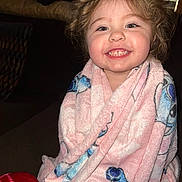 Charlie joined the competition — help win amazing prizes! child, toddler, blanket, smiling, indoor, happy, face, cozy, pink, blue, curly_hair, wrapped, seated, portrait, cute, young, expression, warm, comfort, home