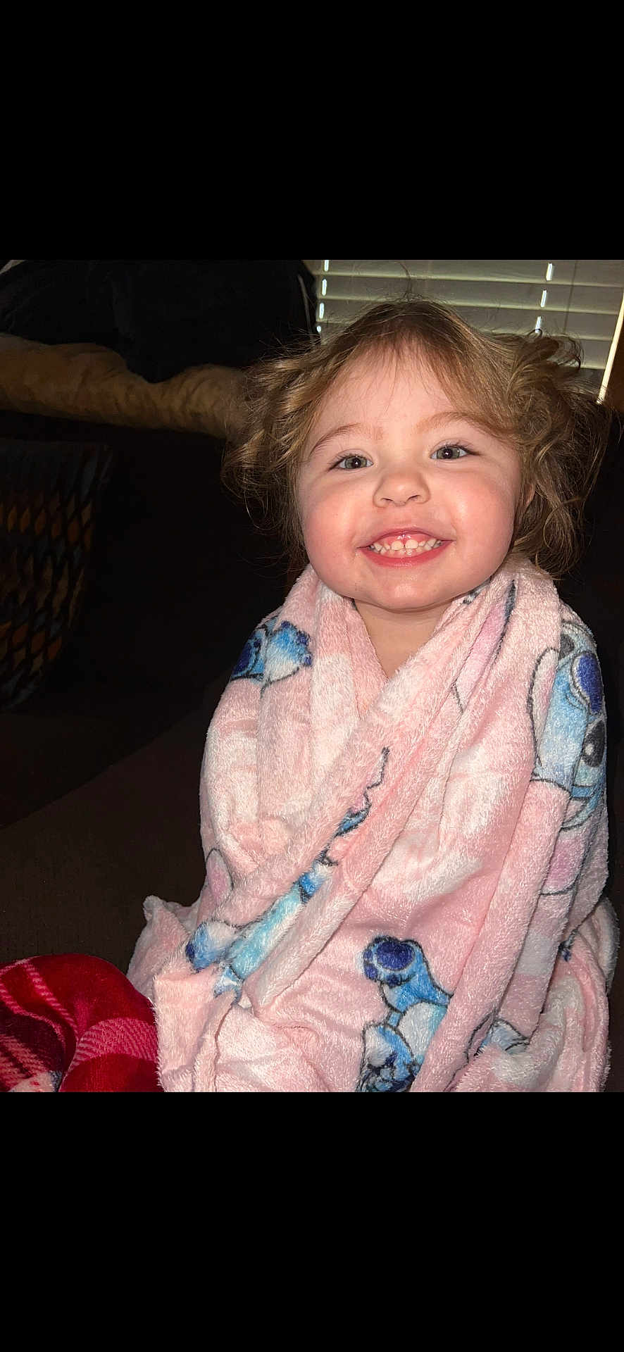 Charlie joined the competition — help win amazing prizes! child, toddler, blanket, smiling, indoor, happy, face, cozy, pink, blue, curly_hair, wrapped, seated, portrait, cute, young, expression, warm, comfort, home
