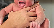 Neena is registered to the contest to win money with this photo: baby, blanket, child, crying, cute, diaper, face, fingers, hair, hands, holding, indoor, infant, newborn, person, portrait, skin, small, toes, yawning