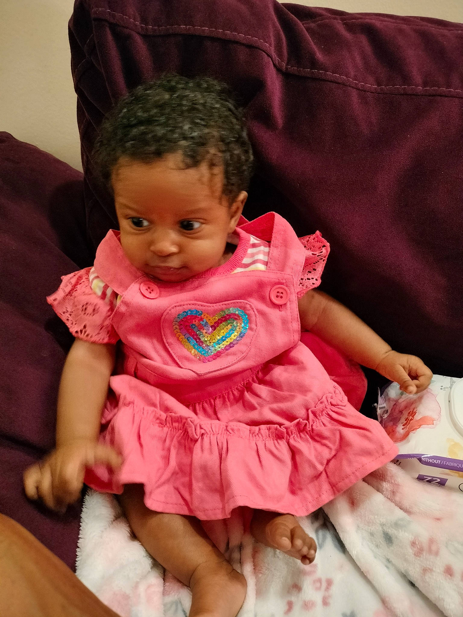 Toni is registered to the contest to win money with this photo: baby, baby_toddler_clothing, cheek, child, comfort, day_dress, dress, embellishment, fun, happy, head, iris, magenta, person, pink, ruffle, sitting, skin, sleeve, textile