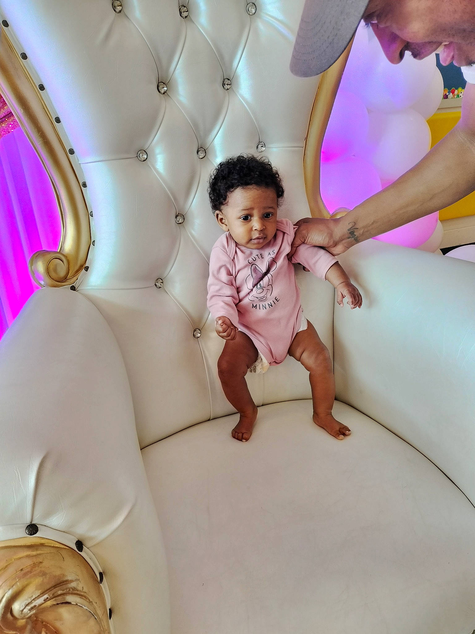 Toni is registered to the contest to win money with this photo: baby_toddler_clothing, comfort, dress, fun, gesture, hairstyle, happy, human, leg, leisure, magenta, material_property, people, person, pink, product, purple, recreation, skin, toddler