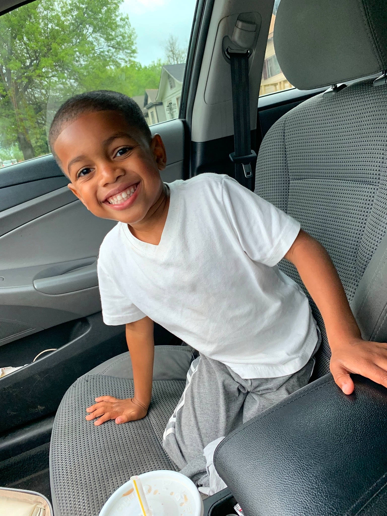 Cedric Brown joined the competition — help win amazing prizes! auto_part, automotive_care, automotive_exterior, car, car_seat, car_seat_cover, child, family_car, joy, luxury_vehicle, motor_vehicle, person, plant, seat_belt, sitting, smile, steering_wheel, vacation, vehicle, vehicle_door