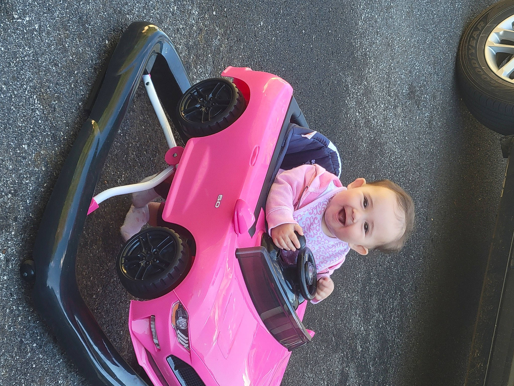 Hailee joined the competition — help win amazing prizes! auto_part, automotive_design, automotive_exterior, automotive_lighting, automotive_tire, automotive_wheel_system, baby_carriage, black, bumper, fender, joy, mode_of_transport, motor_vehicle, person, pink, product, shoe, tire, toddler, vehicle