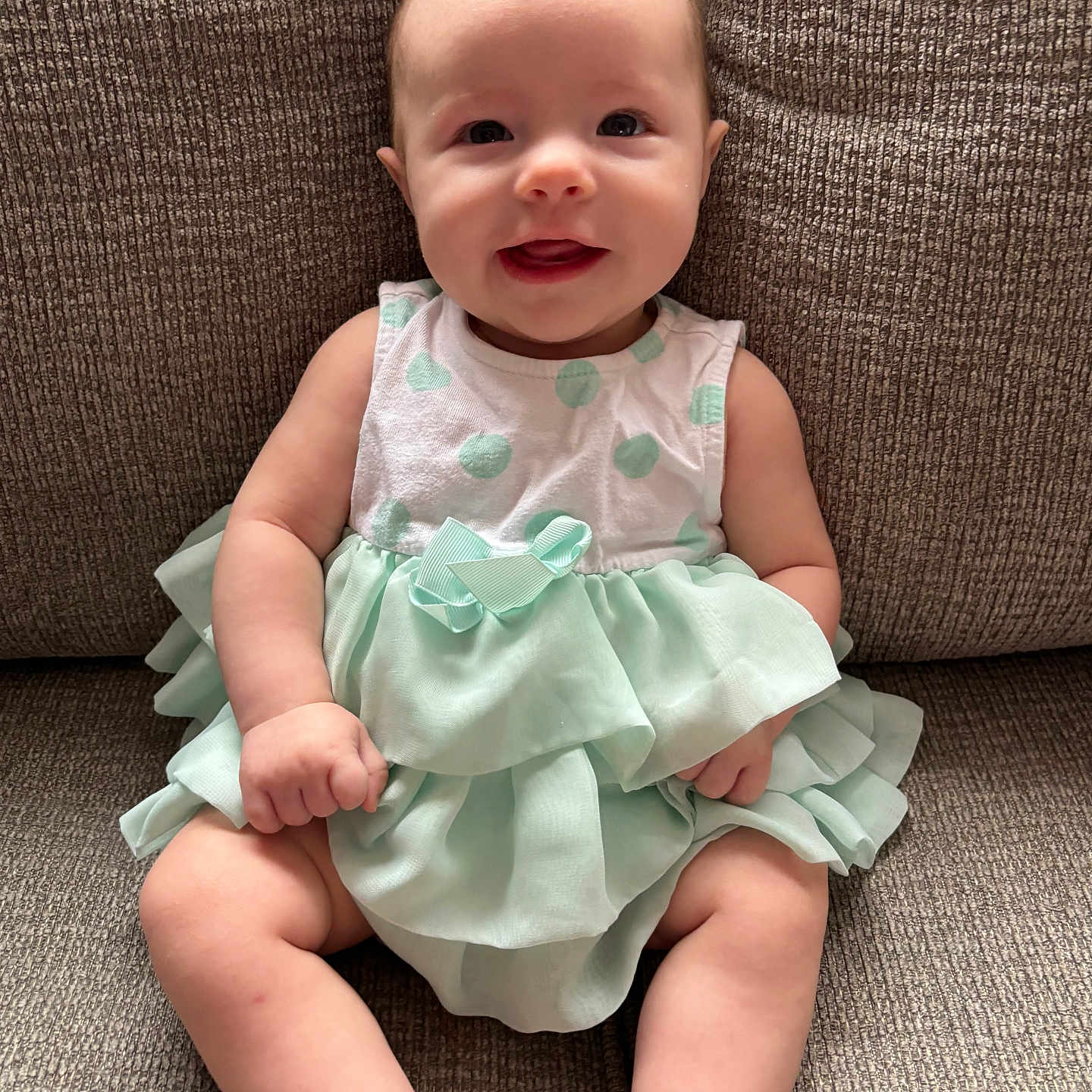 Paisley joined the competition — help win amazing prizes! baby, bodypart, clothing, couch, cushion, dress, face, finger, furniture, hand, happy, head, homedecor, newborn, pants, person, photography, portrait, sitting, toy