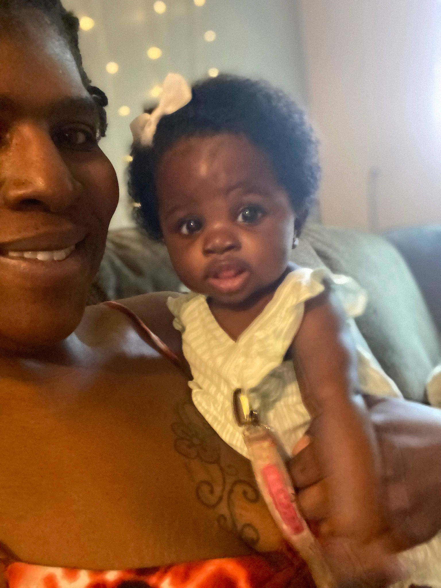 A Riyah is registered to the contest to win money with this photo: adaptation, afro, baby, cheek, child, event, eye, eyebrow, fun, happy, human_body, interaction, iris, jewellery, joy, nose, person, room, skin, smile