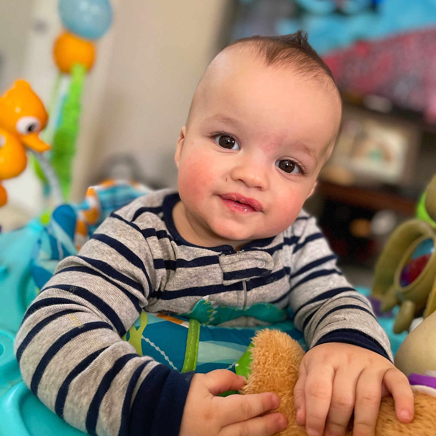 Leo is registered to the contest to win money with this photo: baby, balloon, bathroom, bodypart, face, finger, hand, happy, head, indoors, interiordesign, person, photography, portrait, potty, room, sitting, smile, toilet, toy