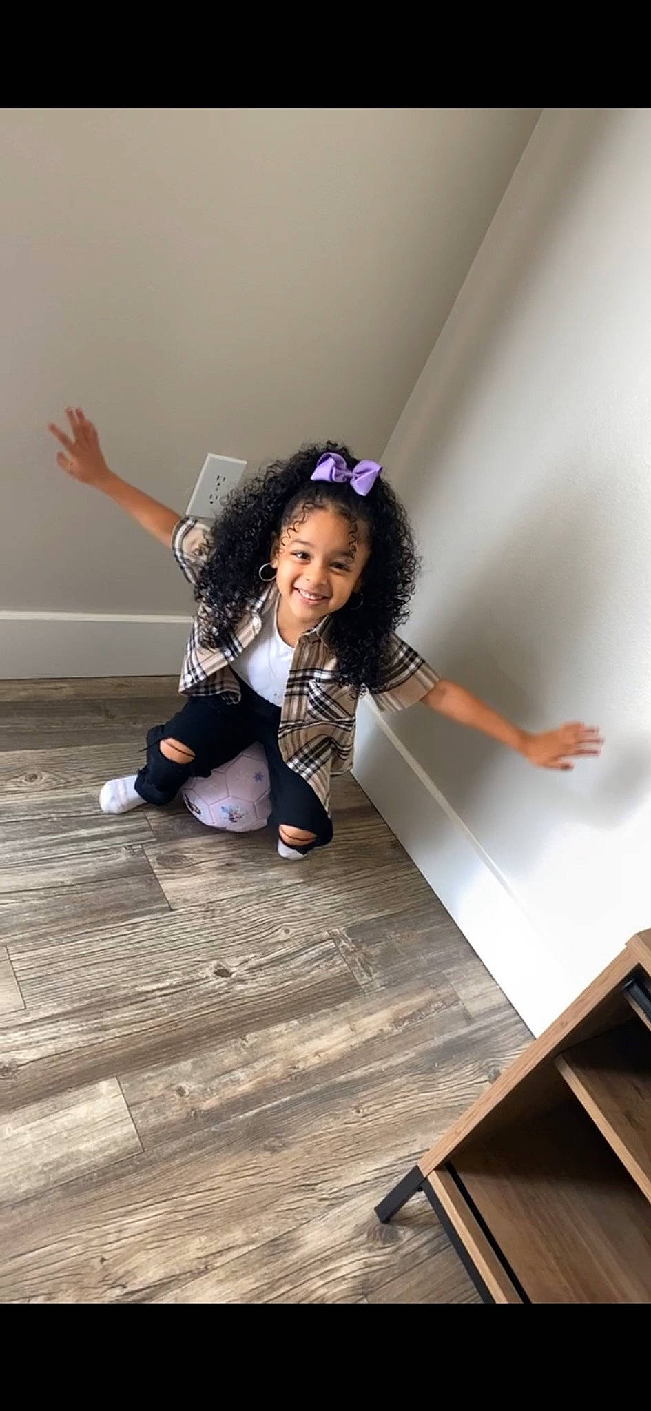 Lylah joined the competition — help win amazing prizes! black_hair, fashion_design, flash_photography, floor, flooring, fun, gesture, happy, hardwood, human_leg, joint, joy, knee, laminate_flooring, person, room, sitting, smile, thigh, waist