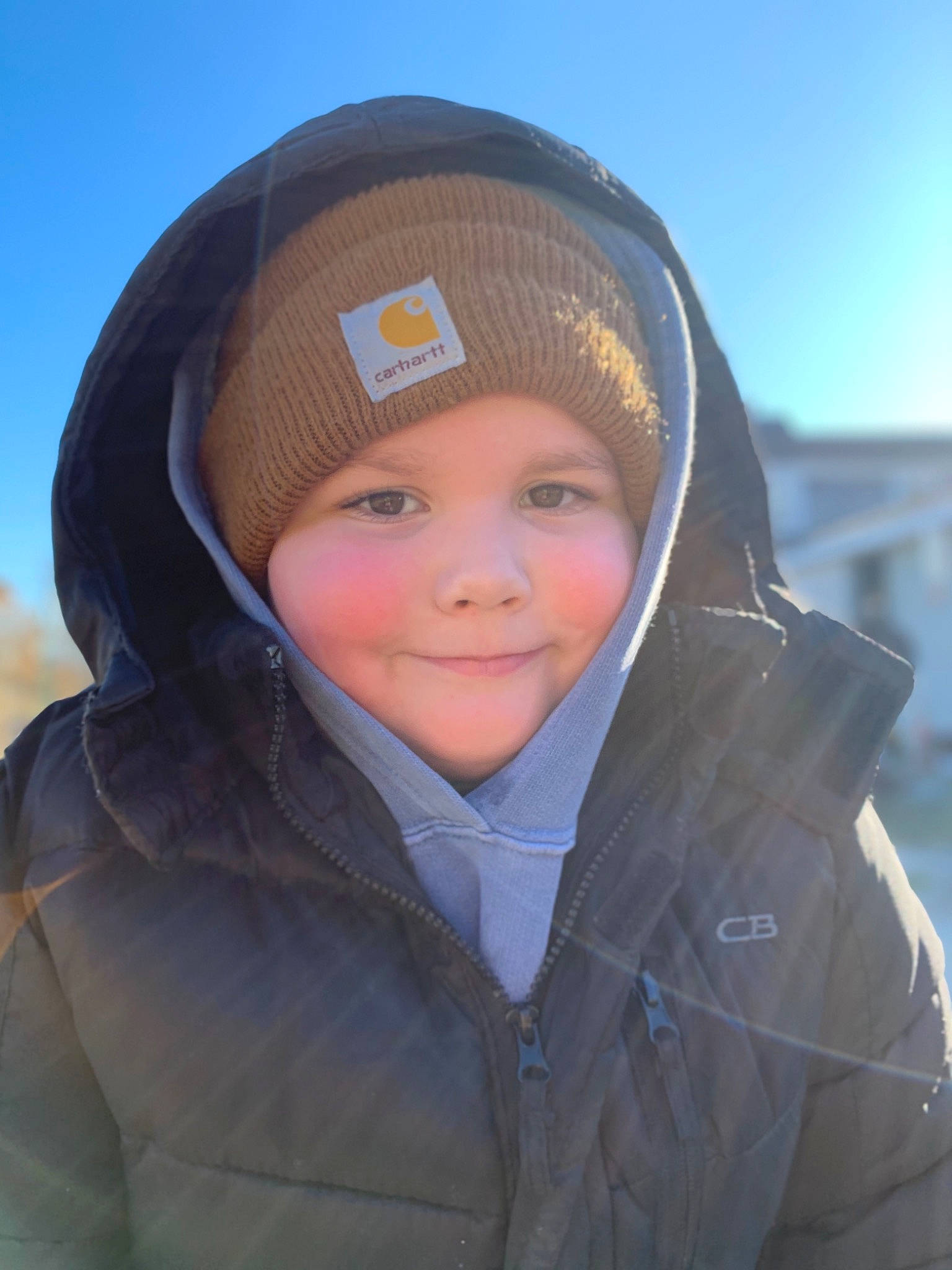 Madden is registered to the contest to win money with this photo: baby, cheek, child, eye, face, forehead, head, headgear, nose, outerwear, person, photography, skin, smile, snow, toddler, vacation, winter