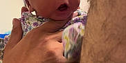 Namylah joined the competition — help win amazing prizes! baby, child, headband, purple, floral_clothing, hand, adult_hand, indoor, door, surprised_expression, person, face, skin, closeup, portrait, infant, cute, newborn, holding, human