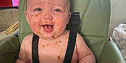 Arlo joined the competition — help win amazing prizes! baby, high_chair, messy, food, smiling, happy, child, face, mouth_open, skin, straps, indoor, window, tv, furniture, seat, cute, expression, chubby, infant