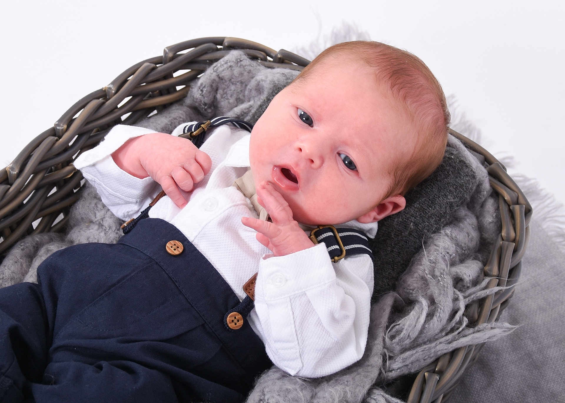 Luca is registered to the contest to win money with this photo: baby, basket, bed, bodypart, clothing, cradle, crib, face, finger, furniture, hand, handcuffs, head, homedecor, infantbed, linen, newborn, person, photography, portrait