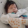 baby, sleeping, child, infant, portrait, plush_toy, stuffed_giraffe, blanket, crib, nursery, cozy, peaceful, indoors, cuddling, pacifier, dark_hair, closed_eyes, soft_lighting, bedtime, toddler