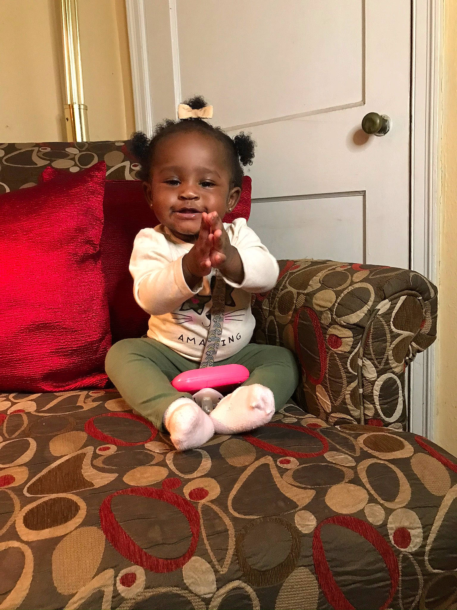 Cassidy joined the competition — help win amazing prizes! baby, baby_toddler_clothing, bed_sheet, bedding, carpet, cushion, foot, home_accessories, human_body, interior_design, lap, linens, living_room, person, pillow, rug, sock, stuffed_toy, throw_pillow, toddler